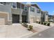 Attractive townhome exteriors with garages, tidy landscaping, and well-maintained surroundings at 1121 Blue Jay Dr, Davenport, FL 33837