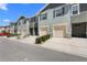 Well-maintained townhomes with attached garages, tidy landscaping, and a freshly paved street at 1121 Blue Jay Dr, Davenport, FL 33837