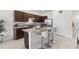 Stylish kitchen with granite countertops, stainless steel appliances, and island seating at 1121 Blue Jay Dr, Davenport, FL 33837