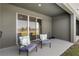 Relaxing patio with outdoor seating and serene views of the lake at 1121 Blue Jay Dr, Davenport, FL 33837