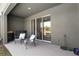 Covered patio with a pair of chairs, offering a great spot for outdoor relaxation at 1121 Blue Jay Dr, Davenport, FL 33837