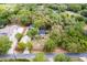 Aerial view of the home and property showcasing the spacious lot and pool at 120 W Trade Winds Rd, Winter Springs, FL 32708