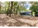 Expansive backyard featuring mature trees, perfect for outdoor activities and relaxation at 120 W Trade Winds Rd, Winter Springs, FL 32708