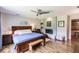 Main bedroom with wood flooring, fireplace, fan and comfortable furniture at 120 W Trade Winds Rd, Winter Springs, FL 32708
