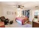 Comfortable bedroom with a ceiling fan and wood-look flooring, creating a serene living space at 120 W Trade Winds Rd, Winter Springs, FL 32708