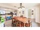 Inviting dining room with view to the kitchen, featuring a large table and stylish lighting at 120 W Trade Winds Rd, Winter Springs, FL 32708