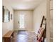 Foyer with tile floor, decorative door and bench at 120 W Trade Winds Rd, Winter Springs, FL 32708