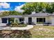 Well-maintained home with white brick, tasteful landscaping, and a two-car garage at 120 W Trade Winds Rd, Winter Springs, FL 32708