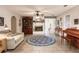 Cozy living room with a fireplace, a floral rug, and access to other areas of the home at 120 W Trade Winds Rd, Winter Springs, FL 32708