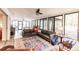 Open living area with view of pool and large windows at 120 W Trade Winds Rd, Winter Springs, FL 32708