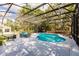 Enjoy the outdoors in this screened in pool with a deck and mature trees at 120 W Trade Winds Rd, Winter Springs, FL 32708