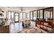Sunroom with large windows and doors leading to a pool area at 120 W Trade Winds Rd, Winter Springs, FL 32708