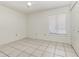 This bedroom has tiled floors, a ceiling fan, and a window with blinds at 1230 Westside Dr, Winter Garden, FL 34787