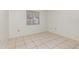 This bedroom features tiled floors and a window at 1230 Westside Dr, Winter Garden, FL 34787