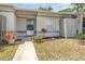 Charming front exterior featuring a well-manicured lawn and walkway leading to the front door at 1230 Westside Dr, Winter Garden, FL 34787