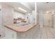 The kitchen features a breakfast bar, white cabinets, and tiled flooring at 1230 Westside Dr, Winter Garden, FL 34787