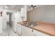 Bright kitchen with white cabinets and plenty of counter space at 1230 Westside Dr, Winter Garden, FL 34787