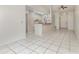 Open-concept living room and kitchen area with tile flooring and a breakfast bar at 1230 Westside Dr, Winter Garden, FL 34787