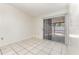 Open living room area featuring tile floors and sliding glass doors to the outside at 1230 Westside Dr, Winter Garden, FL 34787