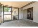 A screened-in patio with sliding door entry and view of the fenced-in backyard at 1230 Westside Dr, Winter Garden, FL 34787
