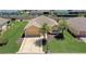 Aerial shot showcasing a home with a well-manicured lawn and inviting curb appeal at 12711 Se 97Th Terrace Rd, Summerfield, FL 34491