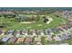 A tranquil community features a variety of homes nestled next to a beautiful golf course and serene lake at 12711 Se 97Th Terrace Rd, Summerfield, FL 34491