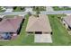 The backyard features an expansive green lawn and a concrete patio, perfect for outdoor entertainment at 12711 Se 97Th Terrace Rd, Summerfield, FL 34491