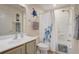 Cozy bathroom featuring a shower-tub combo with soft lighting and beach decor at 12711 Se 97Th Terrace Rd, Summerfield, FL 34491