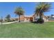 Inviting single-story home with mature palm trees and a beautifully landscaped yard at 12711 Se 97Th Terrace Rd, Summerfield, FL 34491