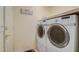 Modern laundry room featuring front load machines and ample space at 12711 Se 97Th Terrace Rd, Summerfield, FL 34491