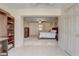 Through a doorway, the office connects to the main bedroom, complete with built-in shelves at 12711 Se 97Th Terrace Rd, Summerfield, FL 34491