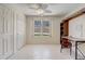 Well-lit home office includes a built-in bookcase and a desk, offering a functional workspace at 12711 Se 97Th Terrace Rd, Summerfield, FL 34491