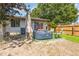 Relaxing backyard features a hot tub, umbrella, patio, and privacy fence at 1303 Azalea Way, Winter Garden, FL 34787