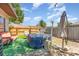 Cozy backyard featuring a covered hot tub, patio furniture, and wood fence at 1303 Azalea Way, Winter Garden, FL 34787