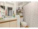 Bathroom featuring a single sink vanity with storage and a stand alone closet at 1303 Azalea Way, Winter Garden, FL 34787