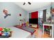 A bedroom with a playful theme, natural light, and hardwood floors at 1303 Azalea Way, Winter Garden, FL 34787