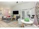 Bright dining area with tile floors, French doors, and a modern table set at 1303 Azalea Way, Winter Garden, FL 34787