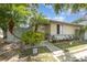 A cozy home featuring a cozy front yard with mature trees and a welcoming entrance at 1303 Azalea Way, Winter Garden, FL 34787