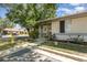 Charming single-story home featuring a cozy front yard with mature trees and a welcoming entrance at 1303 Azalea Way, Winter Garden, FL 34787