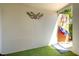 A covered area with artificial turf with open access to the backyard and storage at 1303 Azalea Way, Winter Garden, FL 34787