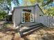 Back of home featuring double doors opening to the living room at 136 Bridgeview Ct, Longwood, FL 32779