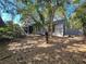Back of home with screened porch, deck and lush backyard at 136 Bridgeview Ct, Longwood, FL 32779