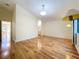 Spacious bedroom features hardwood floors and natural light from the window to outdoors at 136 Bridgeview Ct, Longwood, FL 32779