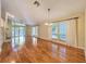 Open-concept living room with hardwood floors, fireplace, and natural light at 136 Bridgeview Ct, Longwood, FL 32779