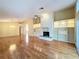 Spacious living room with hardwood floors, fireplace, and built-in shelving at 136 Bridgeview Ct, Longwood, FL 32779