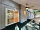 Screened porch with interior access, featuring a ceiling fan at 136 Bridgeview Ct, Longwood, FL 32779