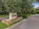 Sign for 'The Springs' community nestled among lush trees at 136 Bridgeview Ct, Longwood, FL 32779