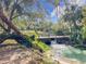 Picturesque water feature with a small bridge and lush greenery, offering a serene natural setting at 136 Bridgeview Ct, Longwood, FL 32779
