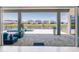 Beautiful patio with outdoor furniture overlooking a pool and peaceful water view at 13828 Tybee Beach Ln, Orlando, FL 32827