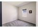Bedroom with gray carpet and neutral walls, offering a serene and comfortable space at 13828 Tybee Beach Ln, Orlando, FL 32827